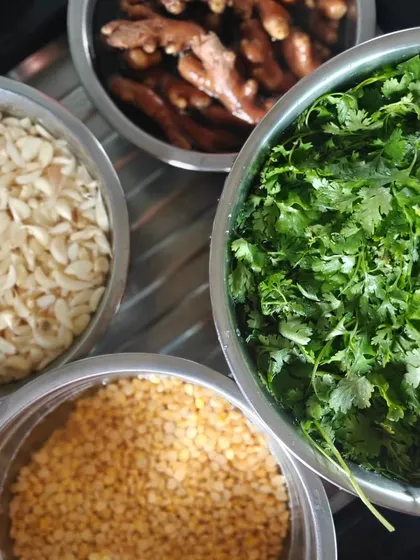 The basics of so many of my mother's recipes. Freshly chopped garlic, ginger, coriander, and lentils form the 'vatan' or paste that is the base of many Maharashtrian curries.