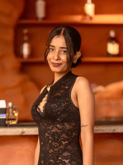 The unique style of the JU:CY crew. A guest posing by the bar, showcasing the fashionable vibe of our Wednesday nights.