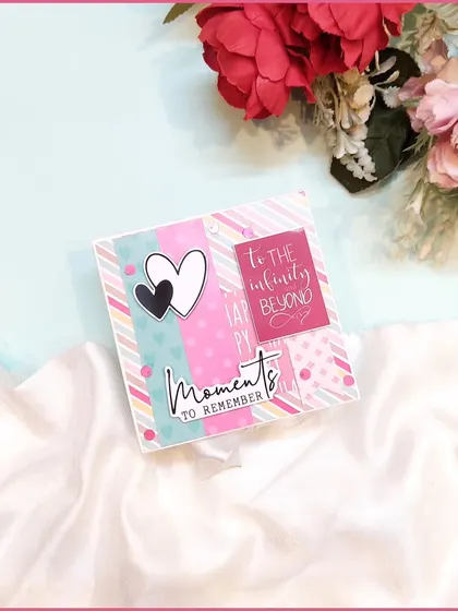 The cover of a mini scrapbook with the message "to the infinity and beyond."