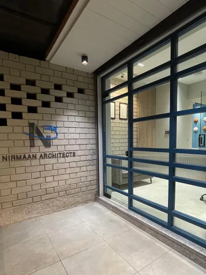 The exterior entrance to our studio, where our logo is mounted on a brick wall with unique perforated details. The design reflects our blend of technical precision and artistic flair.