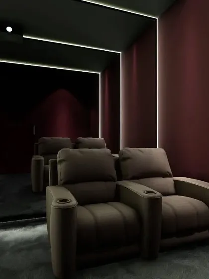 This concept shows a theater with rich, burgundy walls and a mirrored back wall to create a sense of spaciousness.