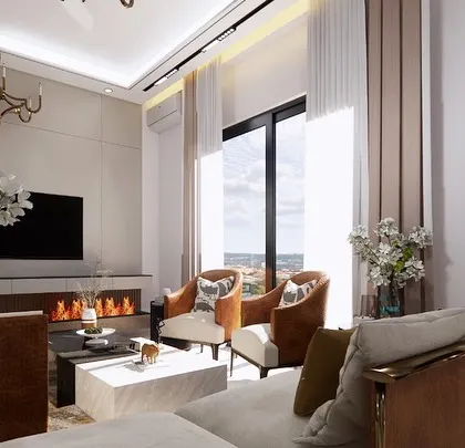 This view highlights the cozy fireplace and large window, which offers an expansive view and fills the room with natural light. The arrangement of accent chairs creates a perfect spot for conversation.
