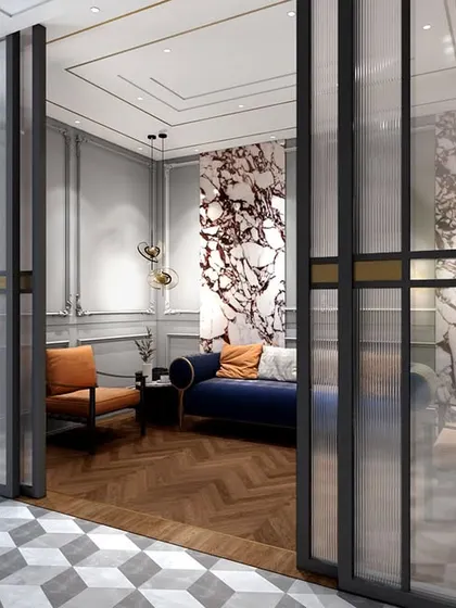 A look into the waiting lounge through fluted glass doors, creating a sense of anticipation. The design is a perfect example of how we create distinct yet connected spaces.