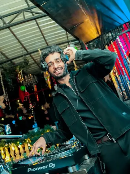 A smiling shot from behind the decks at a New Year's Eve gig. Starting the year with music and joy.
