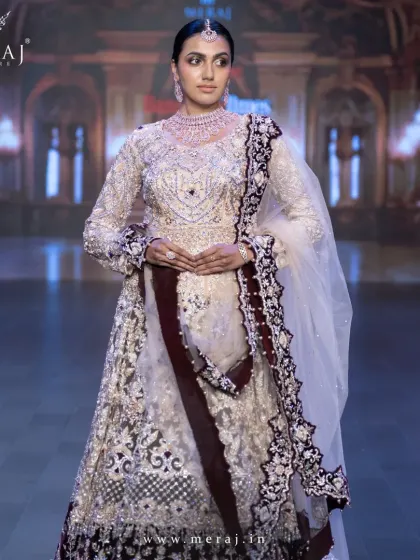A closer view of the Gold and Maroon Indo-Western ensemble, highlighting the bold zardosi hand embellishments that add a touch of opulence.