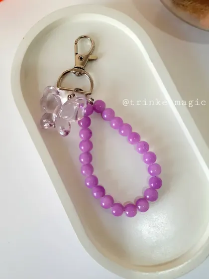 The purple version of my beaded butterfly charm, shown on a clean, white background. The color is so vibrant and perfect for anyone who loves purple.