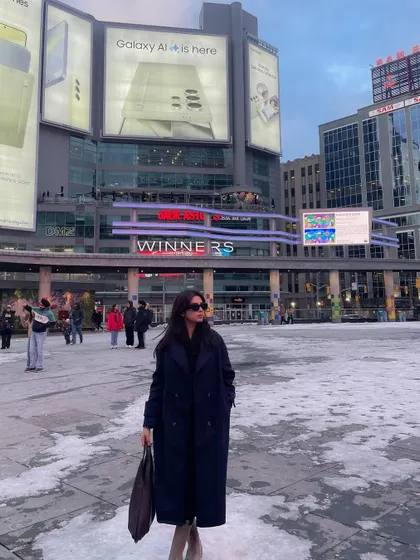 Another look at the Shein coat against the backdrop of Toronto's bright city lights.