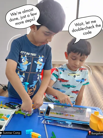 "Wait, let me double-check the code." This moment of collaboration at summer camp shows students working together to debug their project, a crucial skill in both coding and life.