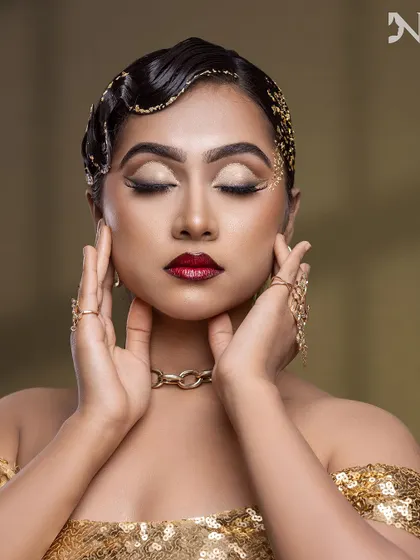 The eyes are closed, but the glamour is wide open. This shot highlights the flawless blending and artistry of the eye makeup.