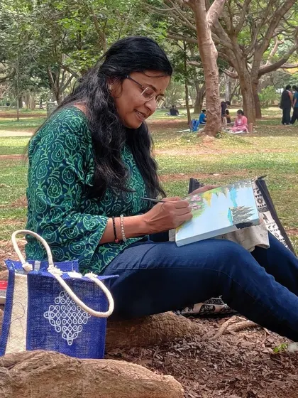 Enjoying a peaceful moment of painting outdoors.