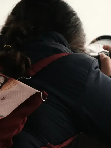 A shot from behind, showing me with my camera and my favorite backpack. I am always ready to find the next picture.