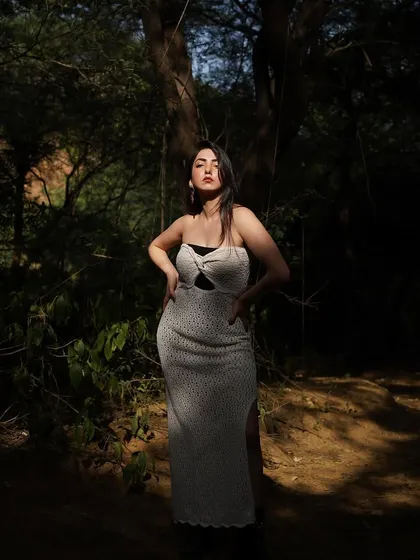 Sunkissed in the forest. This photo plays with light and shadow, creating a dramatic and artistic portrait.