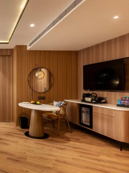 Additional views of the Radisson Resort, Khopoli, showcasing various interior and exterior details, from lobby seating areas and restaurant layouts to guest room configurations and architectural elements.