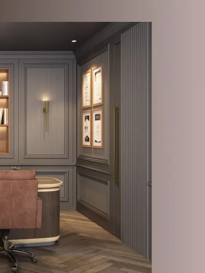 A detail of the custom woodwork and brass hardware in a luxury office space. The fluted paneling and elegant door handle demonstrate our attention to detail in creating a cohesive and high-end design.