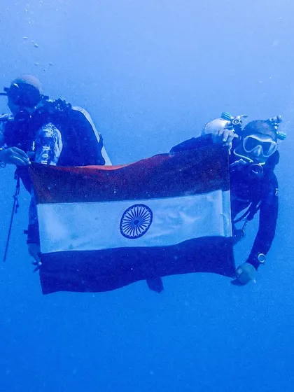 A clear, beautiful shot of our divers celebrating India's 75th Independence Day underwater.