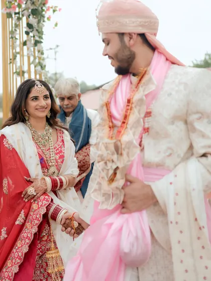 A different angle of the couple's first look, capturing the groom's happy expression.