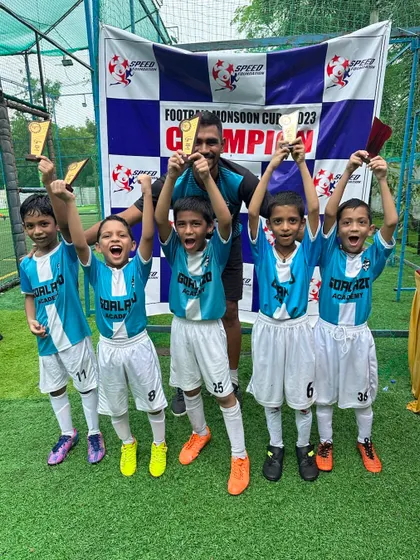 The Under-9 team celebrating their victory at the Monsoon Cup. Look at those happy faces.