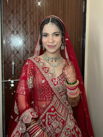 A full smile from this glowing bride. The makeup is designed to be bright and beautiful, perfect for celebrating her wedding day.