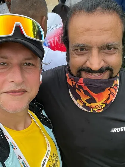 A member with a fellow runner at "The Daredevils" event. We love connecting with the larger running community at these races.