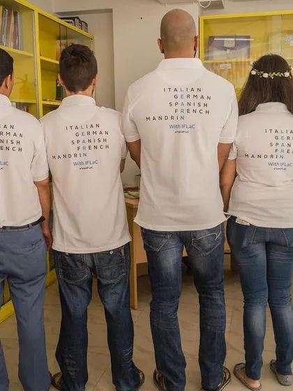 Our students proudly wearing IFLAC t-shirts that list the different languages we offer. It's a symbol of being part of our global learning family.