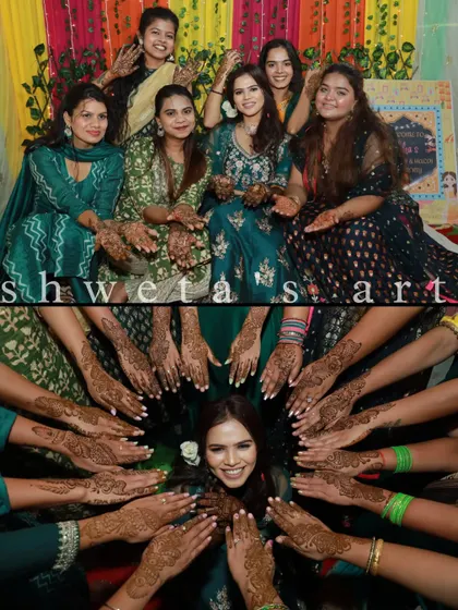 Capturing the happy vibes of a mehendi night. Here is the bride with her entire bride squad, all showing off the beautiful mehendi designs we created for them.