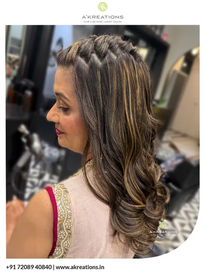 A side view showcasing the beautiful waterfall braid and soft curls, a hairstyle that adds texture and elegance to any ethnic outfit.