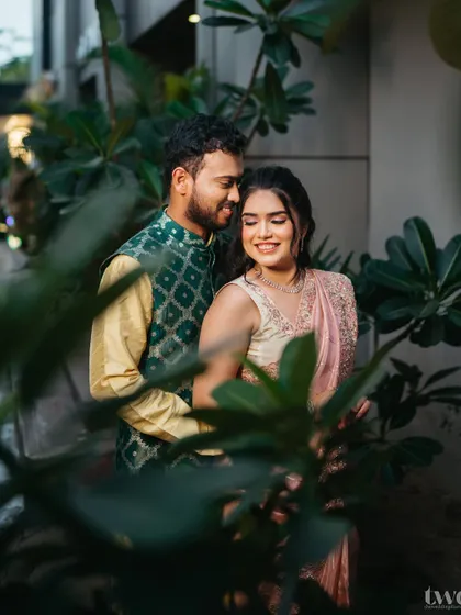 An intimate couple shot. The focus is on their connection, with her makeup looking soft, romantic, and flawless.