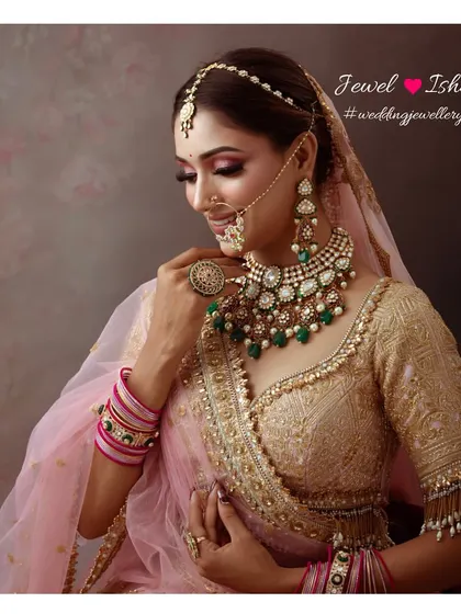 A graceful side profile of the bride, showing off her intricate nath, sheeshphool, and the elegant drop of her polki choker.