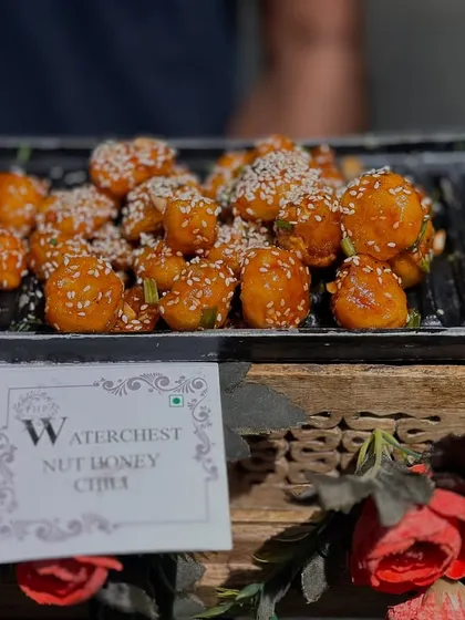A close-up of our Waterchestnut Honey Chili starter. This Indo-Chinese favorite is crispy, sweet, and spicy, making it a popular choice for cocktail parties and sangeet nights.