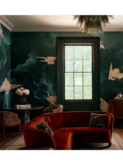 For a dark and moody ambiance, I suggest wallpapers like this one from the 'Flight' collection. The deep green and gold cranes create a dramatic, elegant, and slightly mysterious atmosphere, perfect for a lounge or study.