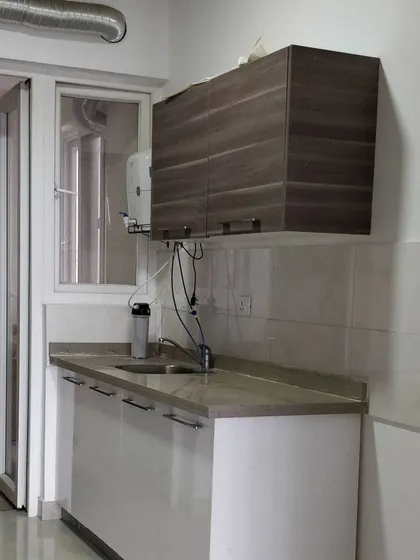Before shot of the Breeze Home kitchen utility area.