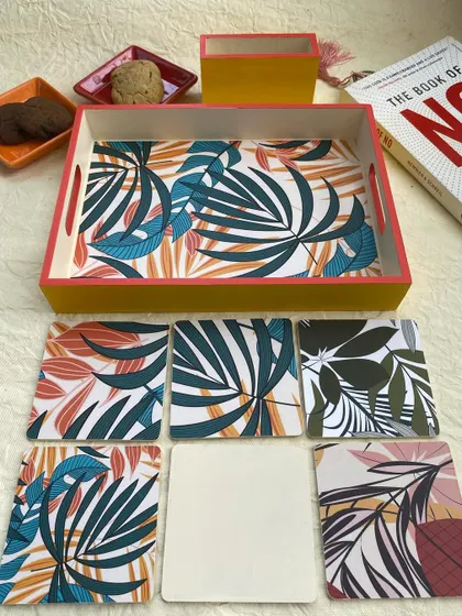 Showing the set of six coasters with their different but coordinating tropical leaf designs.