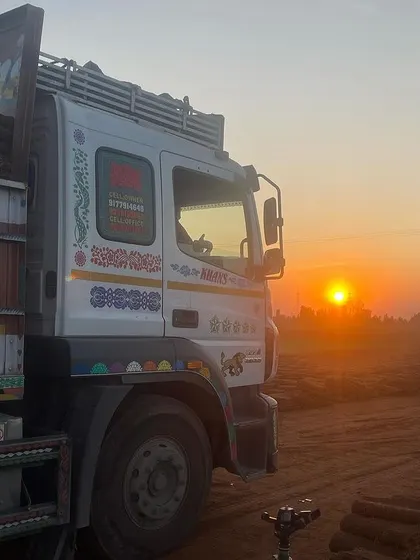 An early morning shot of a truck loaded with my grass, ready to head out for delivery at sunrise.