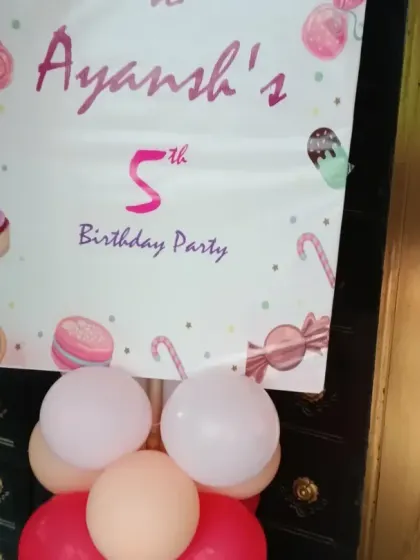 The welcome poster for Ayansh's 5th birthday Candyland party, featuring cute candy and ice cream graphics.