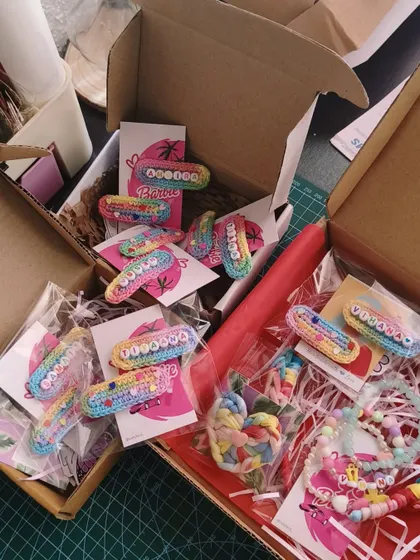A box full of happiness! Packing up a large order of our unicorn name clips for a birthday party.