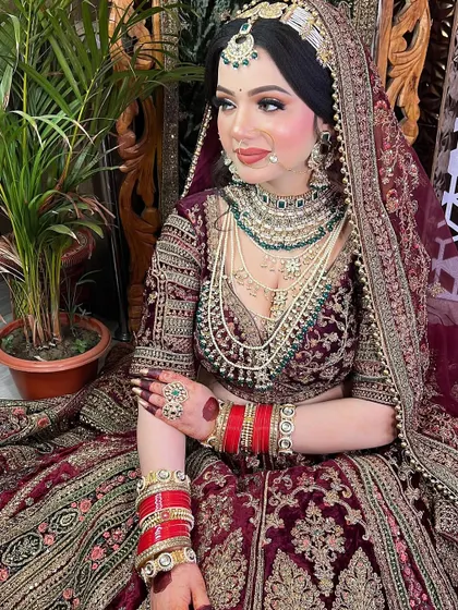 A full-length view of the bride, showing how the makeup, hair, jewelry, and outfit all come together to create a cohesive and breathtaking final look.