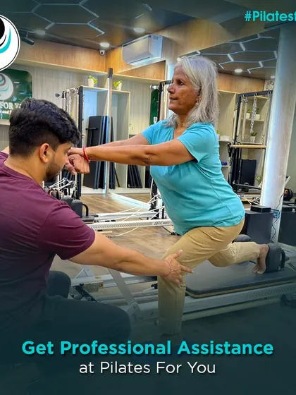 I provide professional assistance to clients of all ages and abilities. Here, I'm guiding a client through a lunge on the Reformer, helping her build balance and lower body strength safely.