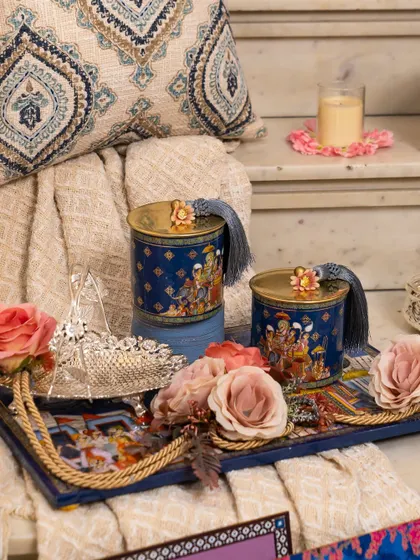 A detail shot of a tray from the Golden Dunes collection, featuring artisanal jars and fresh roses. This highlights my focus on combining textures and elements to create a rich, multi-sensory gifting experience.