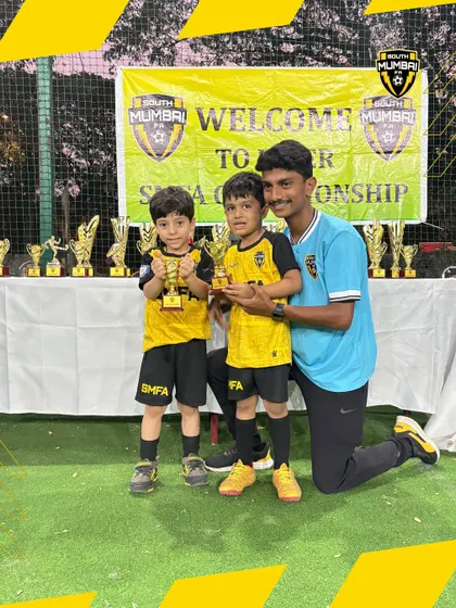 Two of our toddler champions with their coach. We provide personalized attention to ensure every child develops at their own pace.