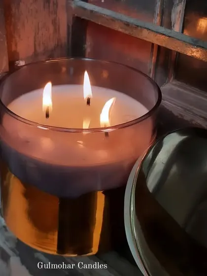 This 3-wick candle in a smoke glass jar with a metallic gold bottom is pure luxury. It lasts for days and gives a very classy look.