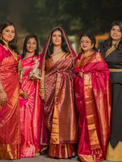 A lovely portrait of the bride with the important women in her life, all dressed in beautiful traditional sarees.