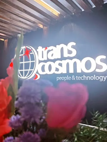 I ensure your brand is front and center. Here, the Trans cosmos company logo is highlighted with carefully placed floral arrangements during their office event.