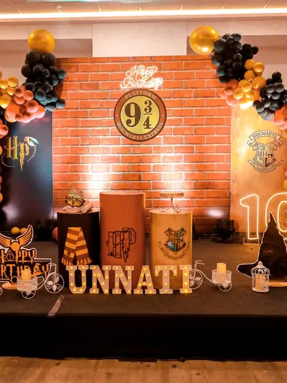 A charming 'Woodland' themed birthday party, with rustic decor, forest animal cutouts, and natural elements, creating a cozy and enchanting setting.