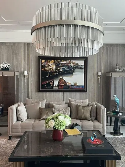 For this apartment in DLF The Camellias, we created a serene living space with a neutral wall palette as a backdrop for contemporary furniture and art. The design reflects the client's globe-trotting lifestyle and preference for chic, understated interiors.