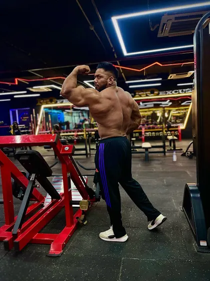 A back double bicep pose. No sacrifice, no success.