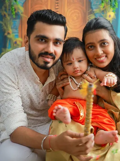 A perfect family portrait celebrating Janmashtami. Having mom and dad join the session with their little Krishna creates a memory that the whole family will treasure forever.