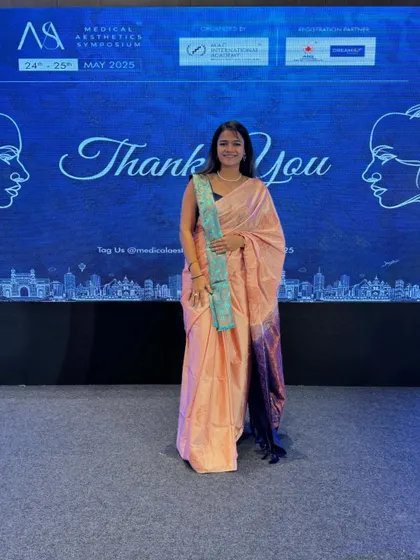 My look for Day 1 of the symposium, an elegant peach saree that brought a traditional touch to the corporate event.