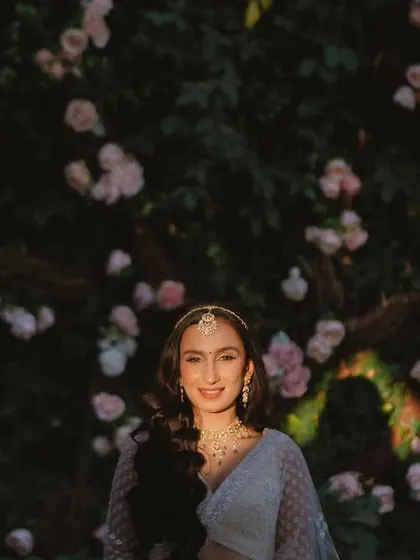 A beautiful close-up of the bride, with a rainbow light flare adding a touch of magic to her smile.