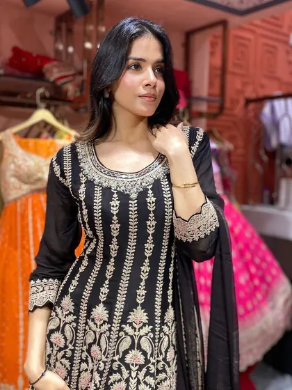 Discover the allure of this black embroidered kali suit, where intricate details meet a classic silhouette for timeless style.