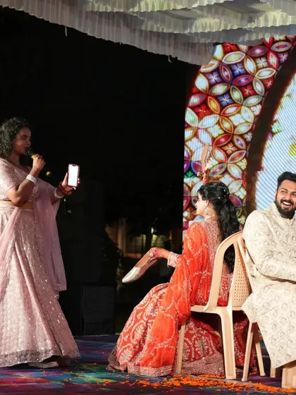 Our host conducting the popular "Shoe Game" with the couple. We plan a variety of games and activities to keep the evening flowing and the guests entertained.